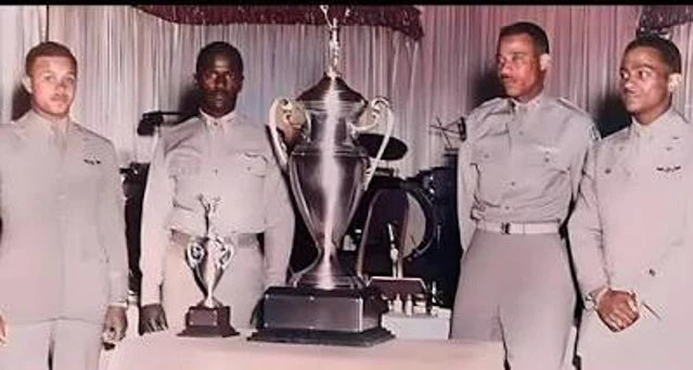 Tuskegee airmen with a trophy